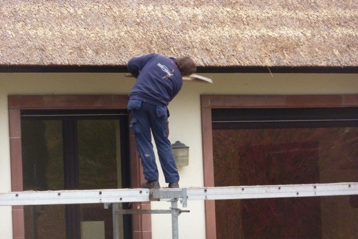 opkloppen rieten dak